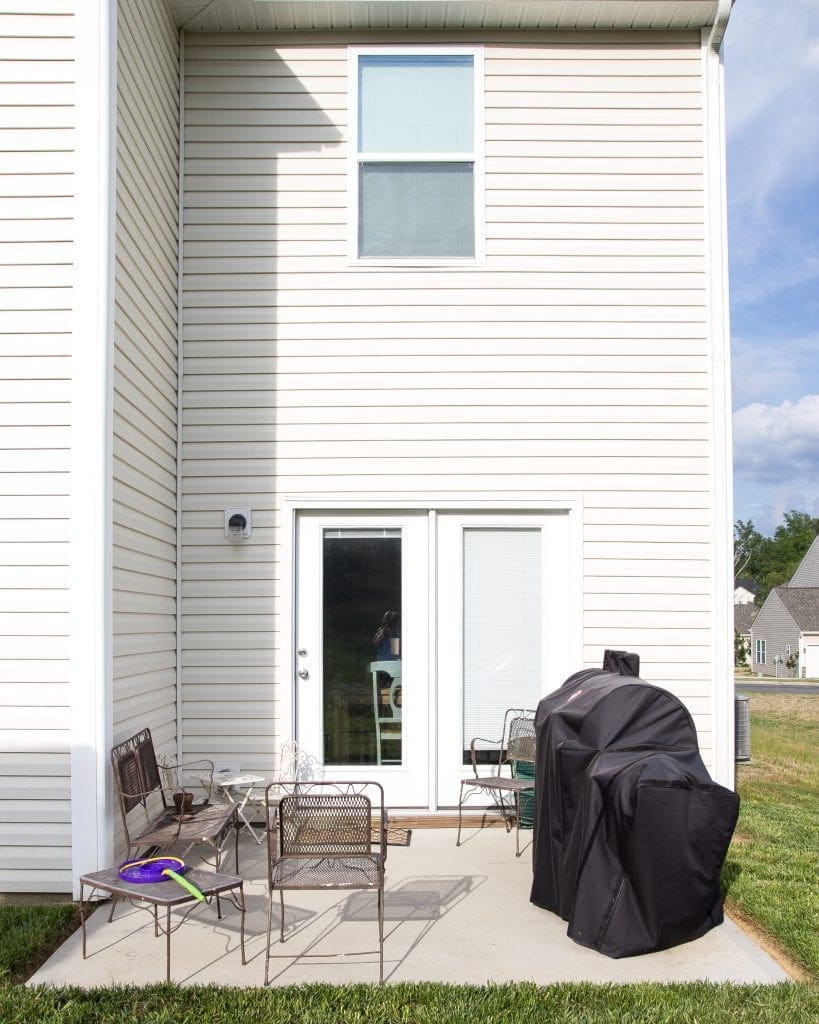 How to Decorate a Small Patio | blesserhouse.com - Utilize a small patio space with chairs at each corner and a fire pit in the middle for function and entertainment. Add string lights for a cozy ambience.