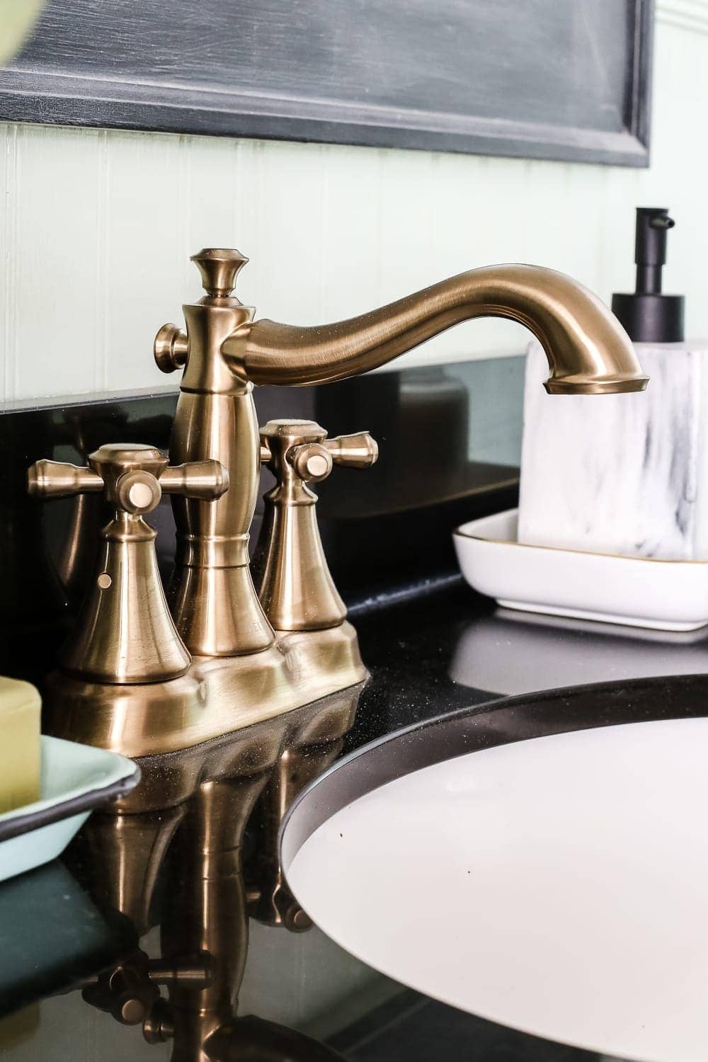 Aqua Meets Urban Powder Room Reveal | blesserhouse.com - A dated powder room gets a modern meets traditional, urban meets farmhouse makeover with aquas, black and white, and antique brass. 