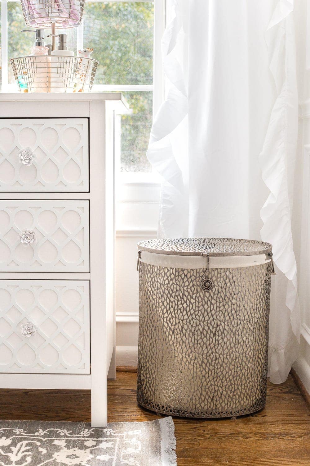 Nursery Organization | Use a lidded hamper with a liner for easy washing and to contain baby smells. 