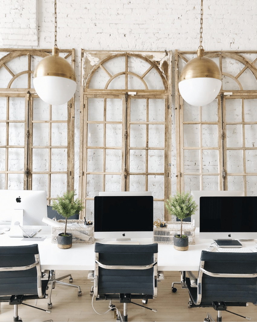 windows leaning on a brick wall for office wall decor