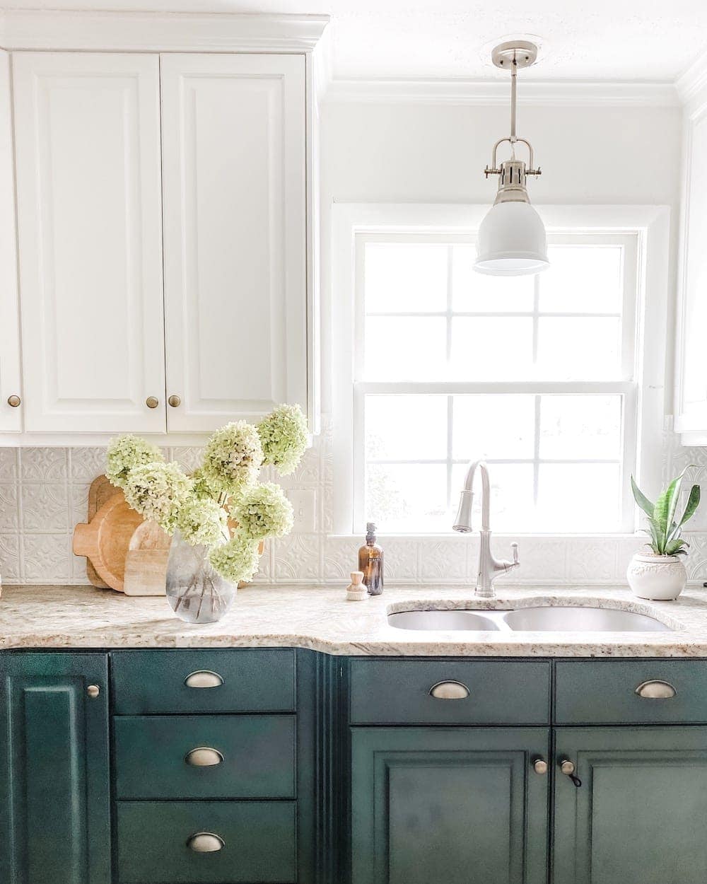 air dried hydrangea flowers in a vase on a kitchen countertop