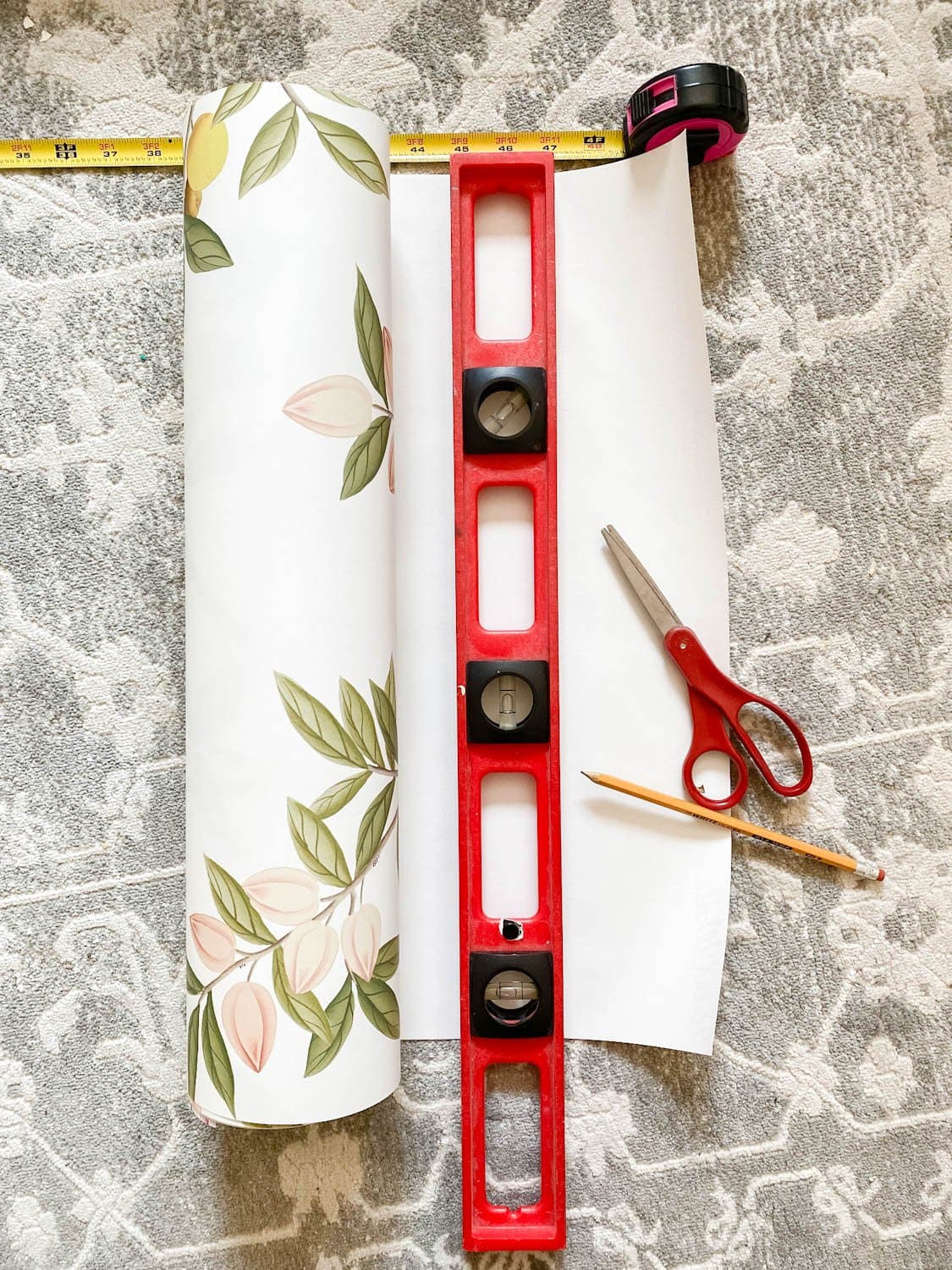 measuring and cutting wallpaper