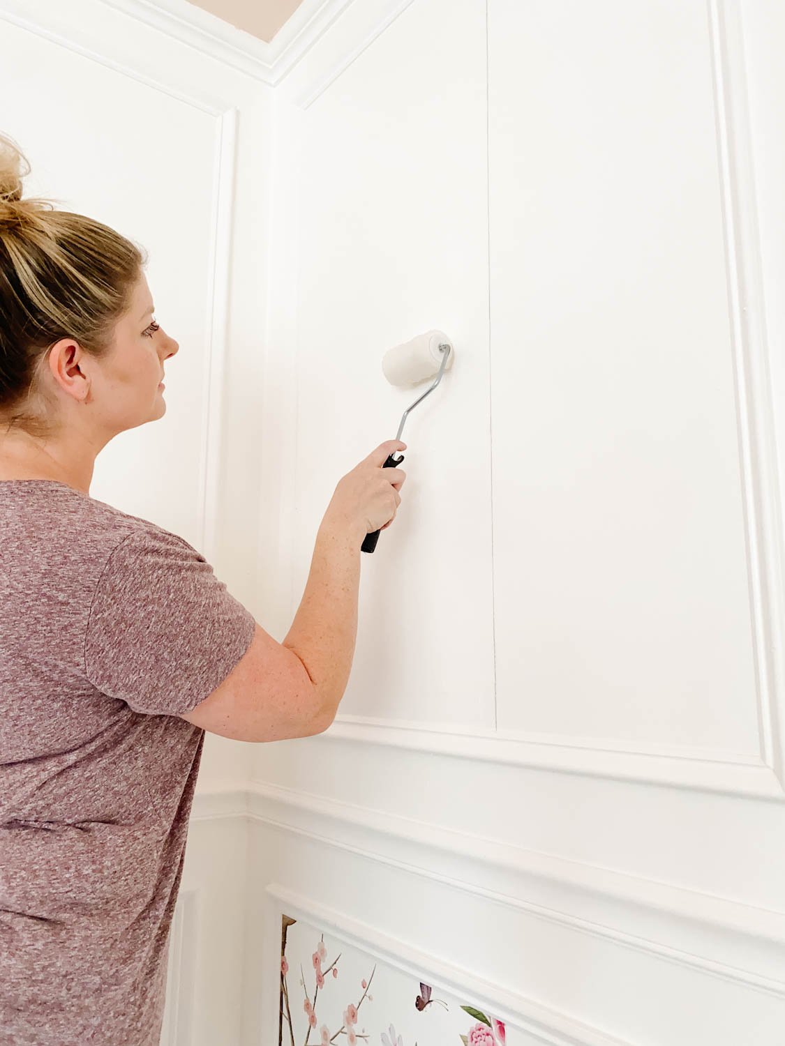 applying paste to wallpaper inside picture frame molding