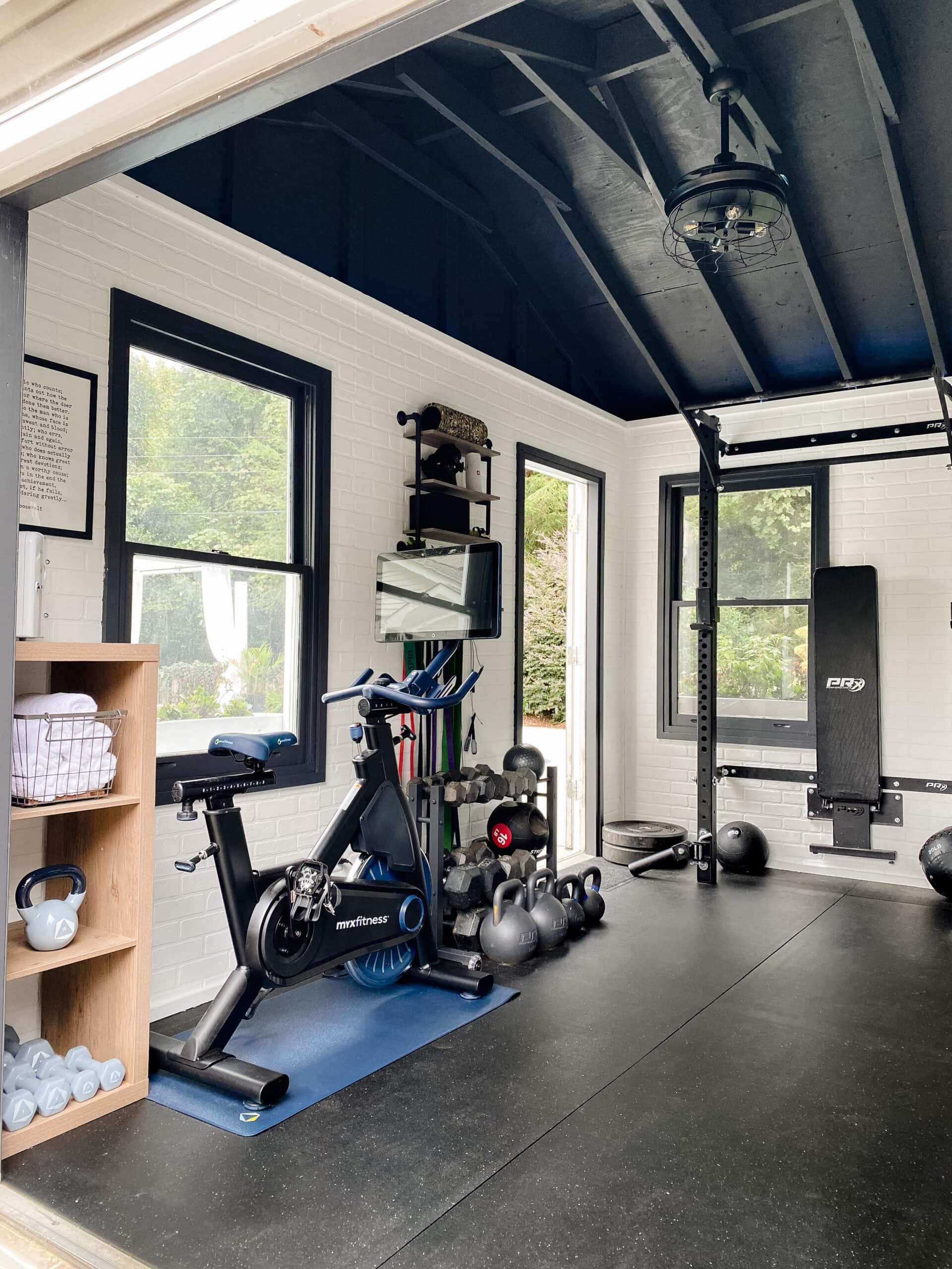 home gym equipment in a repurposed shed