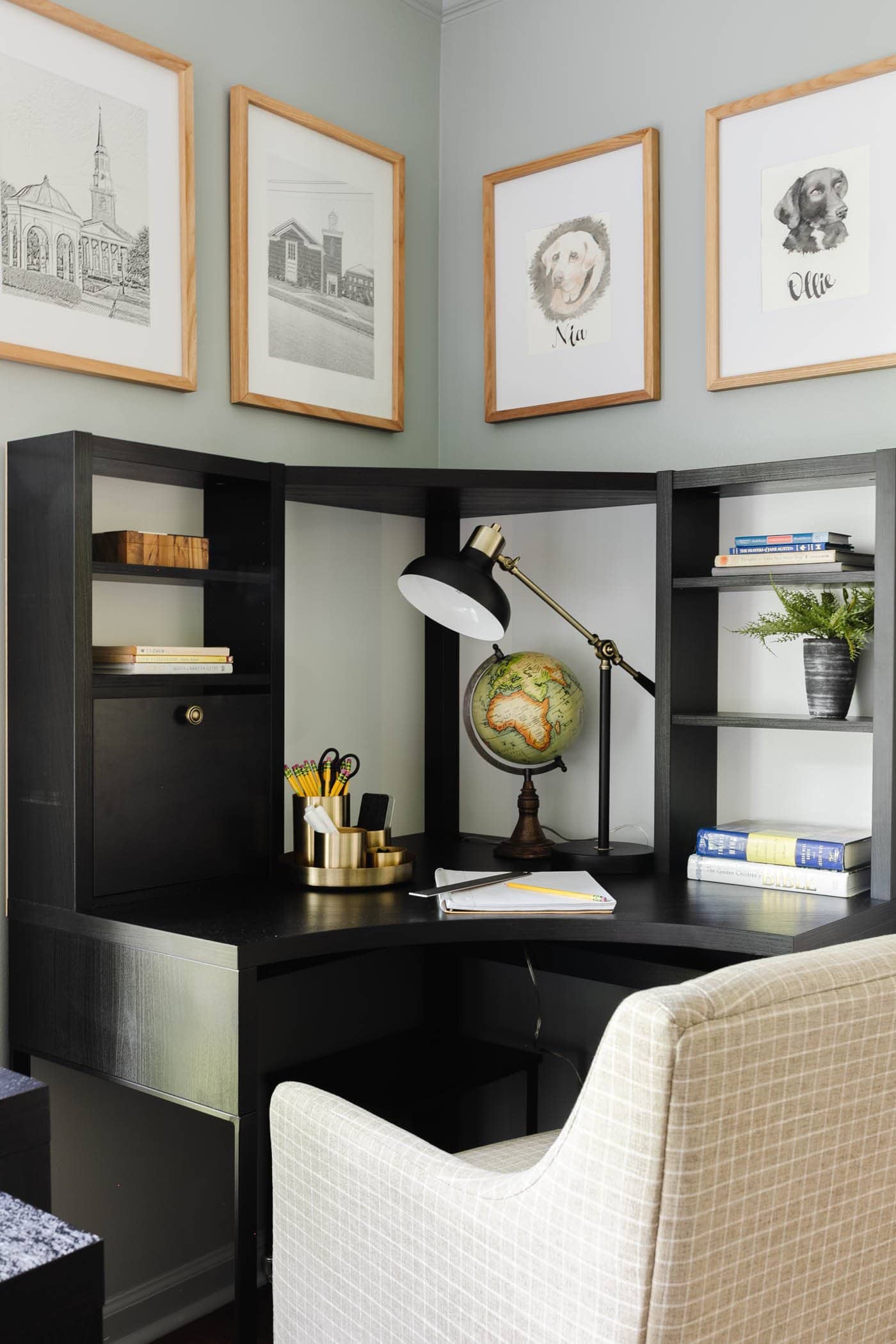 corner desk in a school room for homeschooling and office supply organizer, desk lamp, globe, and upholstered desk chair