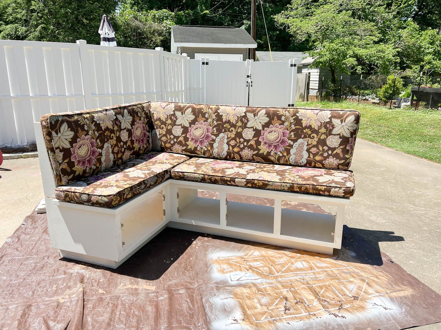 corner banquette before with old fabric on cushions