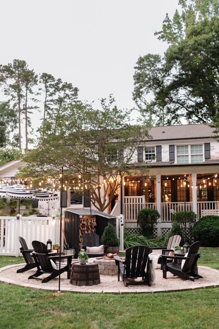 backyard fire pit with string lights
