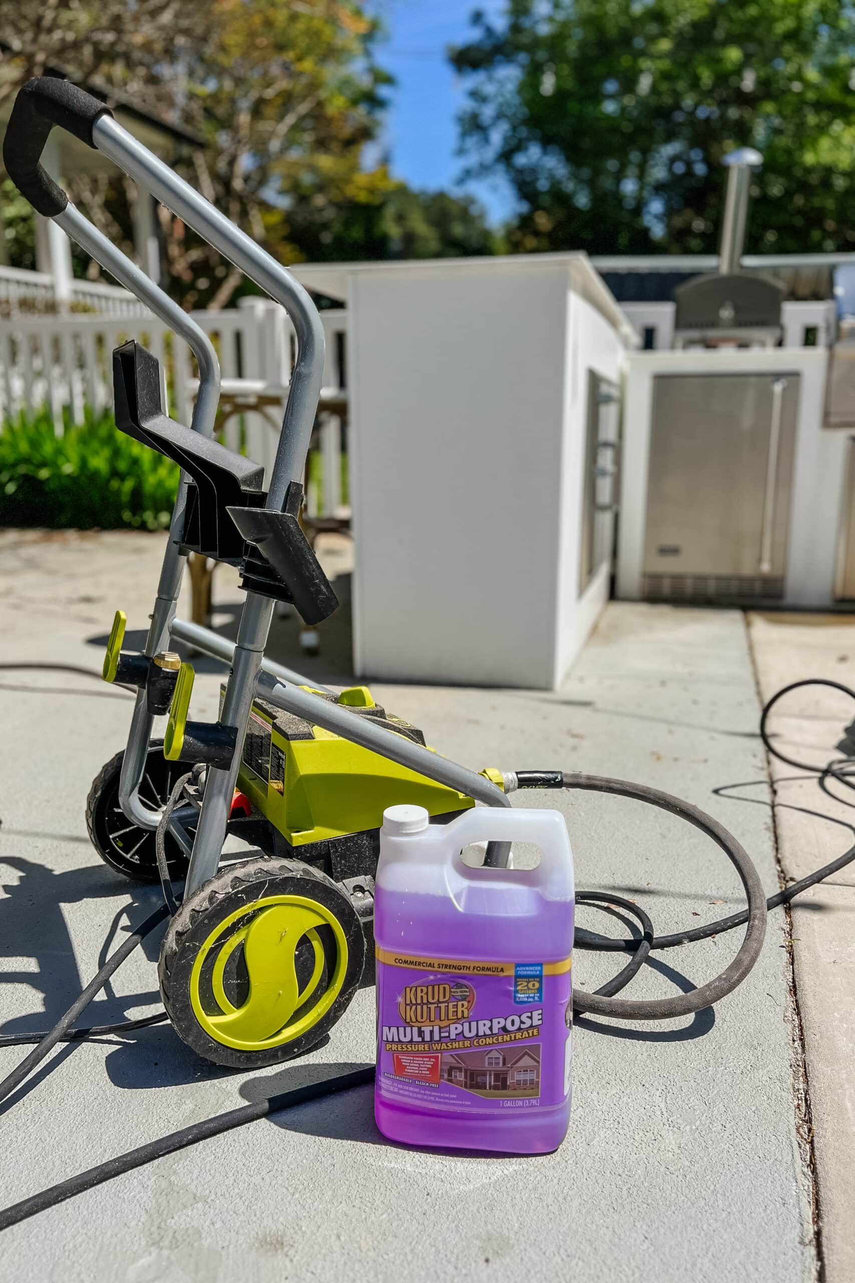 using a pressure washer and krud kutter cleaner for spring cleaning a patio