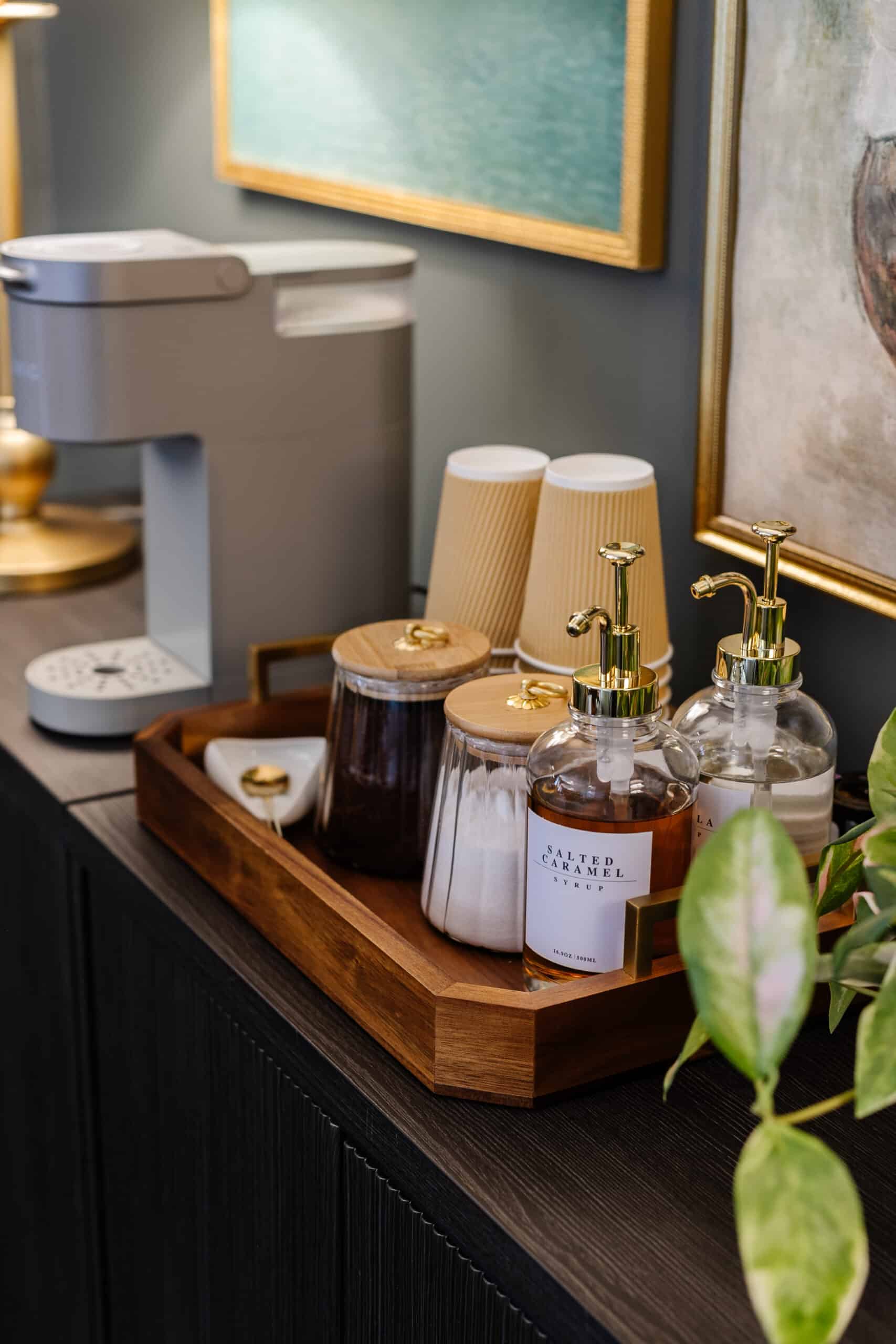 sideboard, gallery wall, and coffee station in a conference room