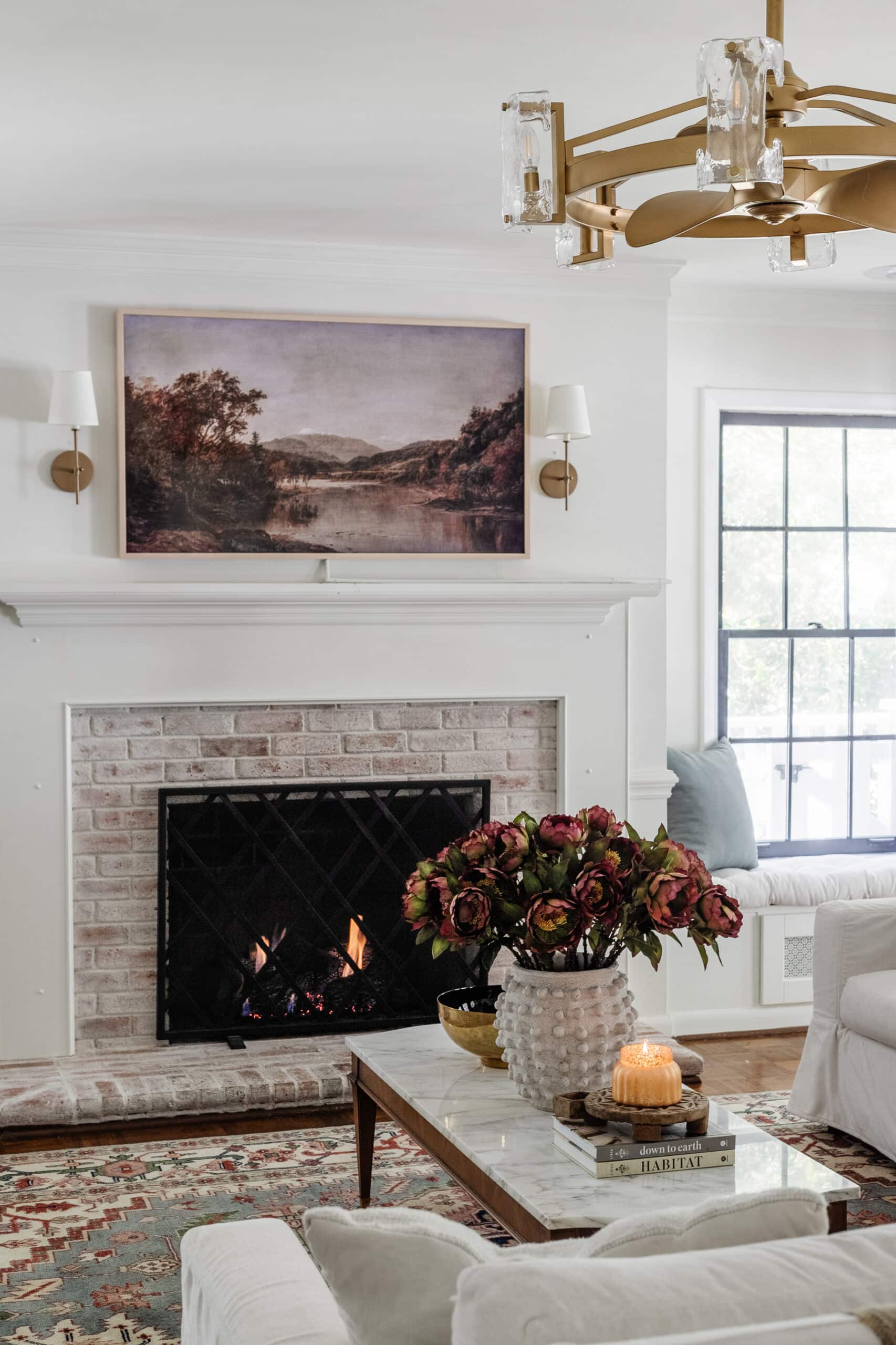 fall art on samsung frame tv above fireplace