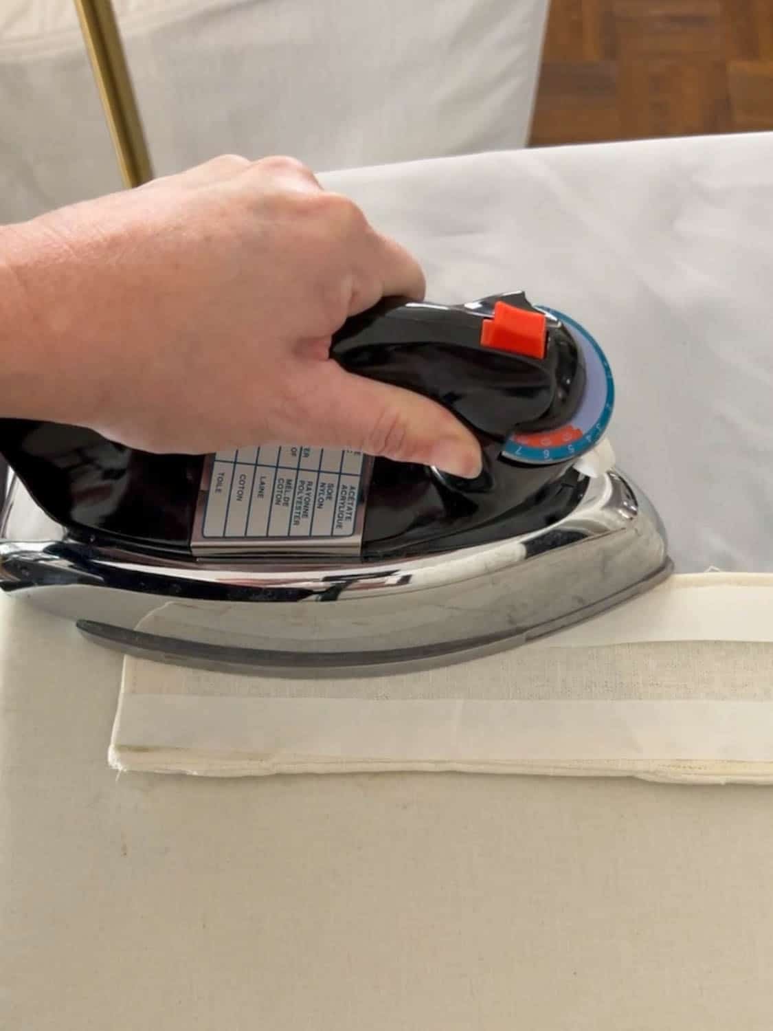 ironing hemming tape on a curtain