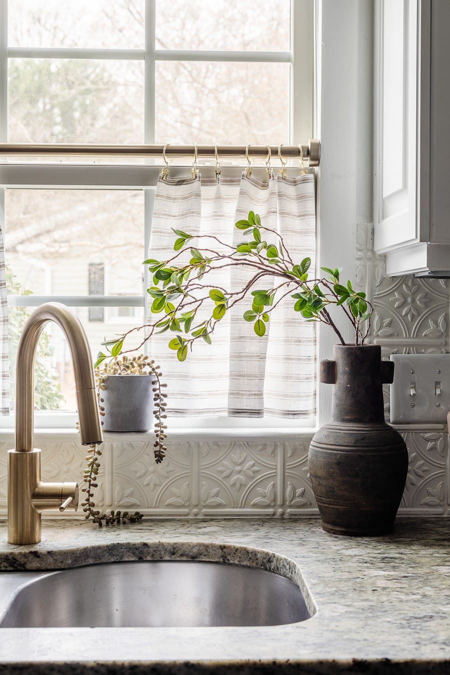 ticking stripe cafe curtains in a kitchen window