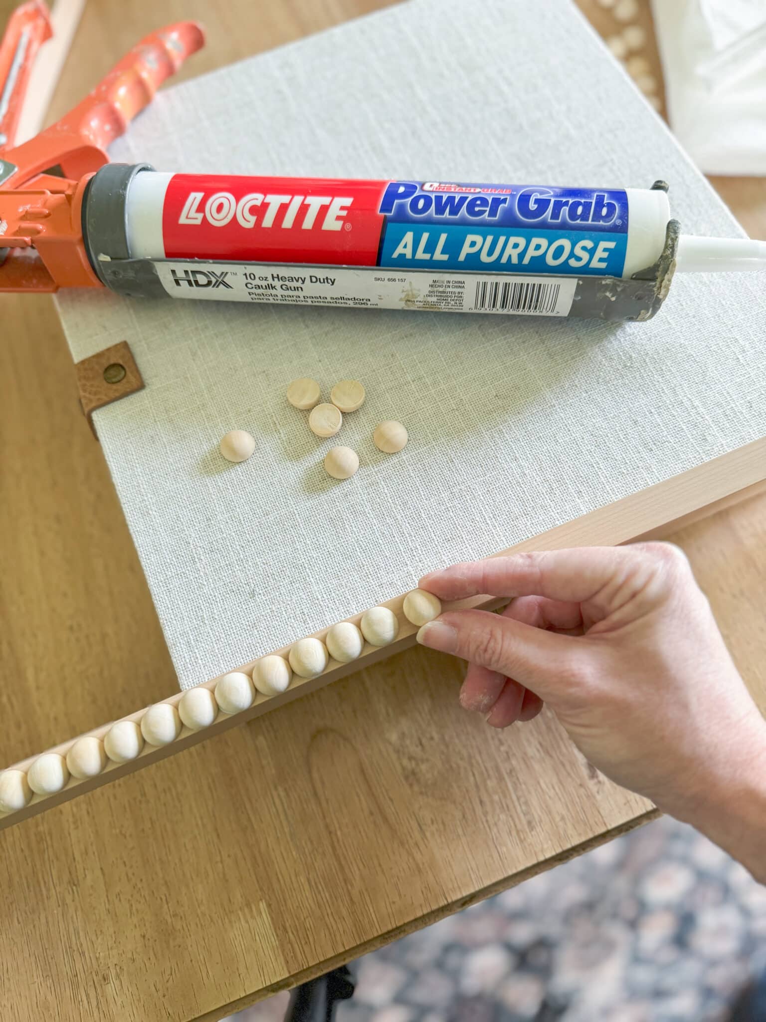 applying wooden split balls to a tv frame