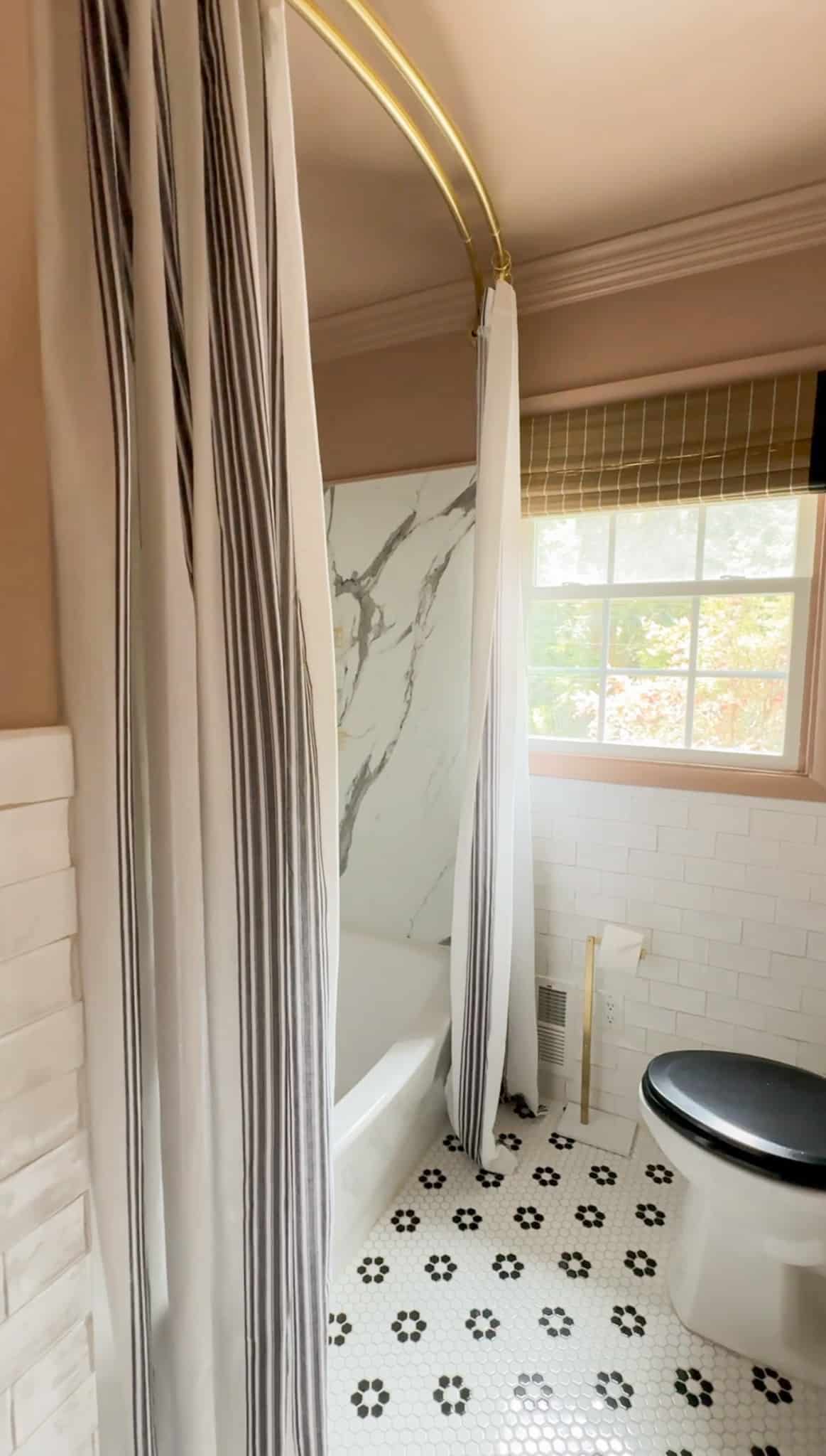 double curtain panels as extra long shower curtain in a bathroom