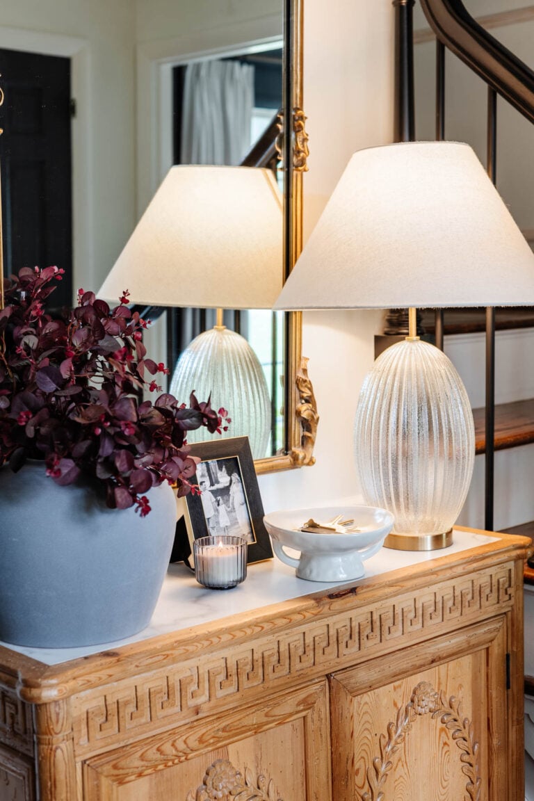 footed bowl used as key holder on entryway table