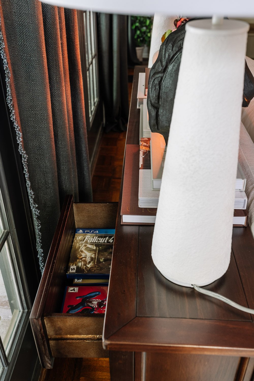 playstation game storage in a living room console table