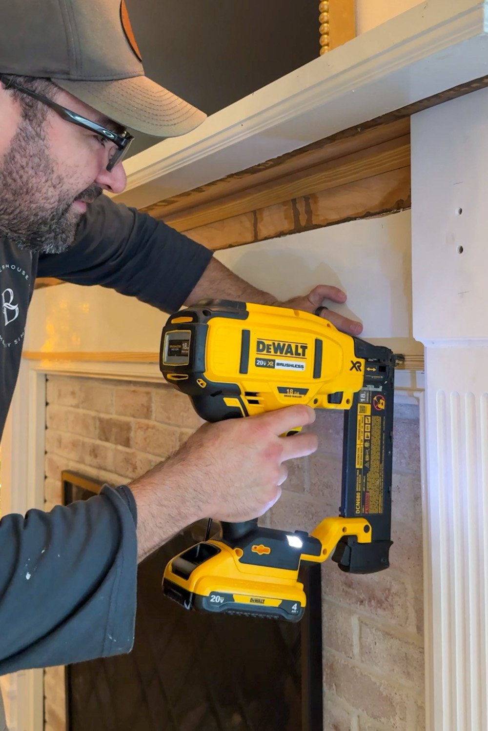 attaching 1x board to fireplace with nail gun
