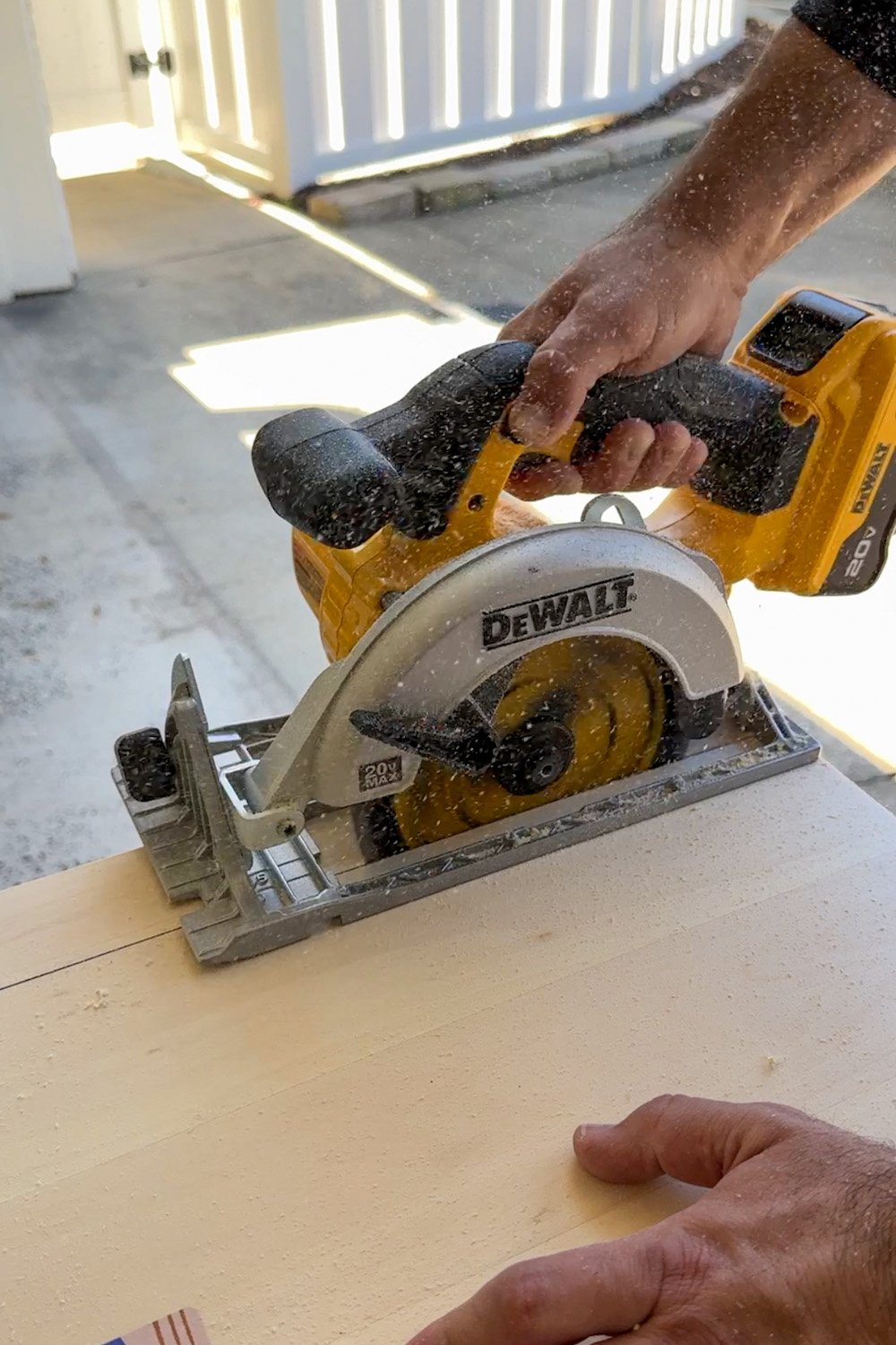 cutting plywood piece for fireplace trim with circular saw