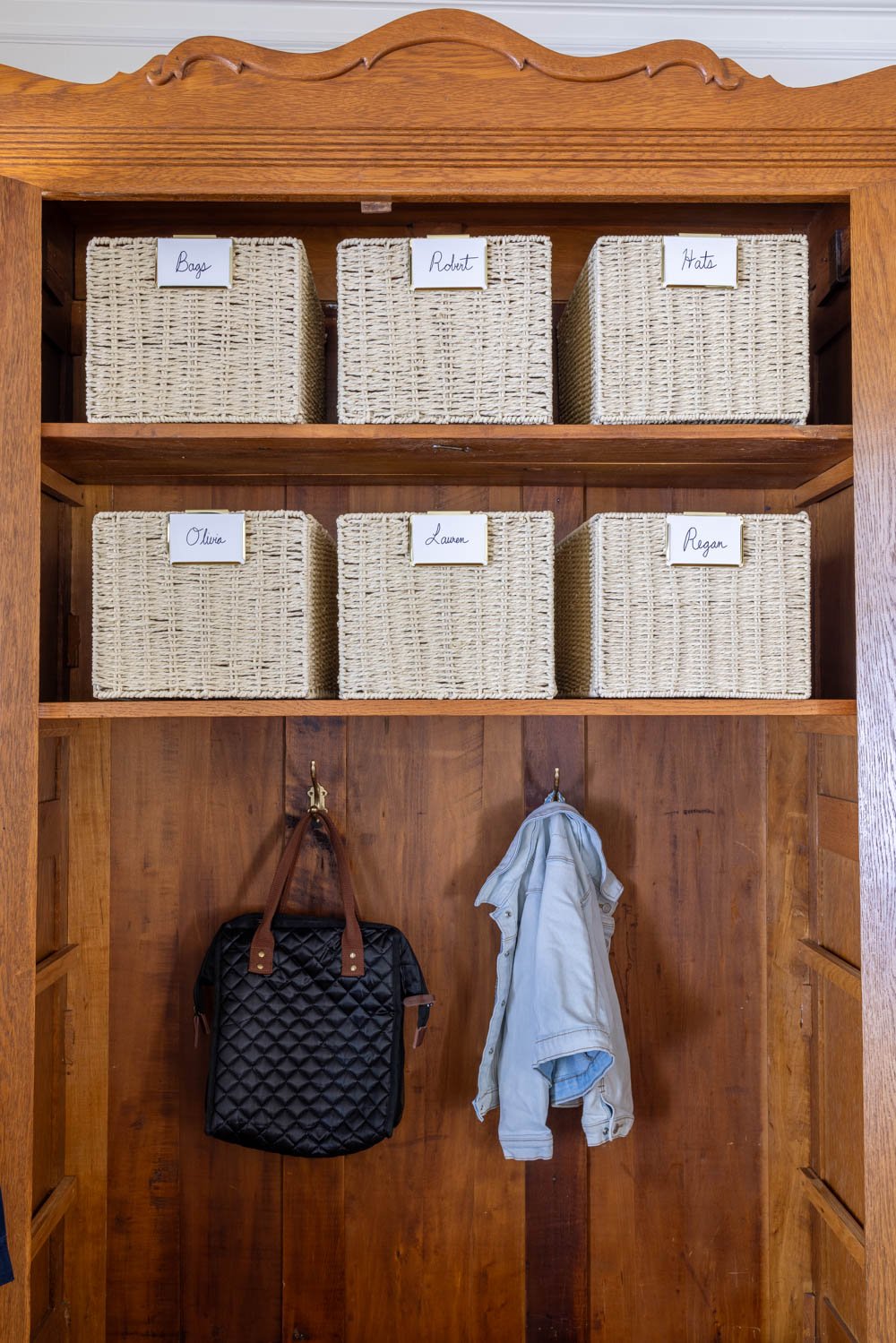 armoire coat closet in an entryway for storage without a mudroom