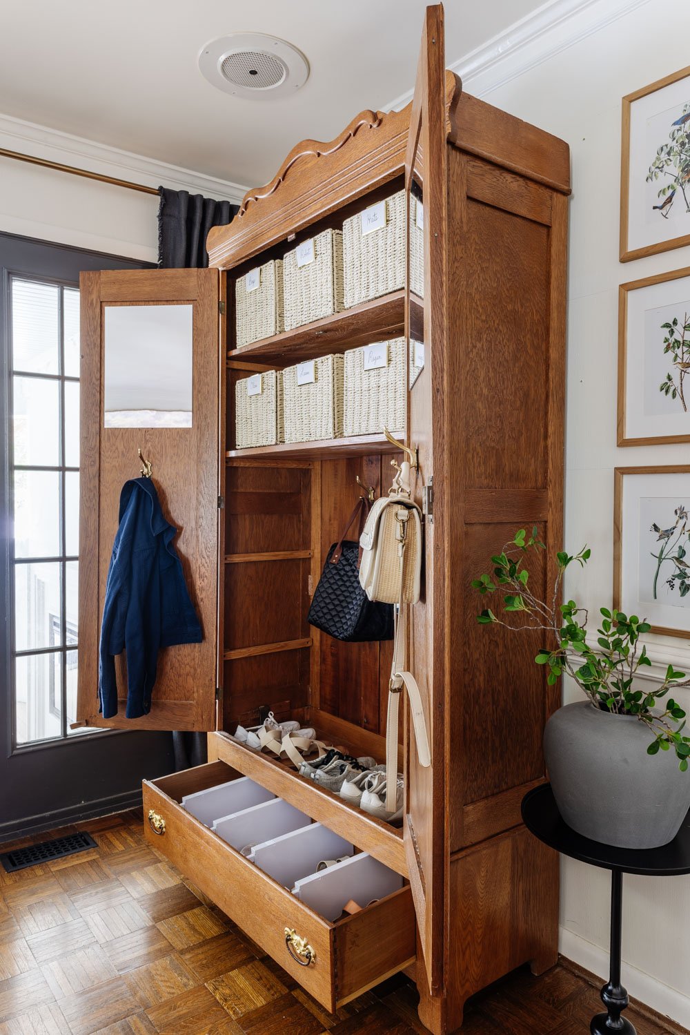 armoire coat closet in an entryway for storage without a mudroom