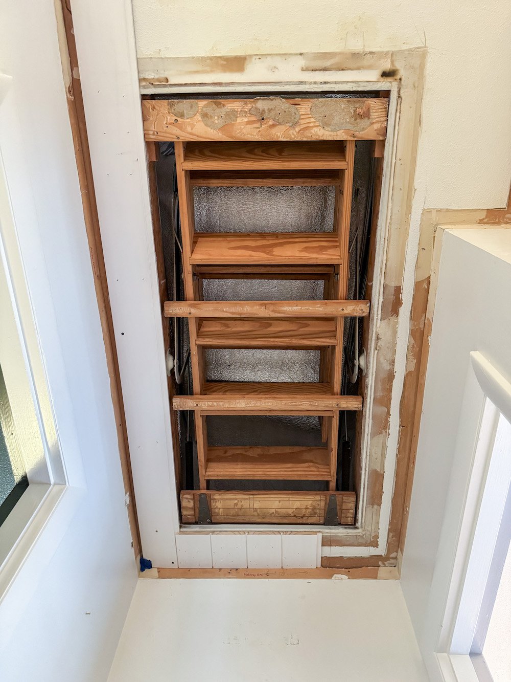hide attic door with shiplap planks