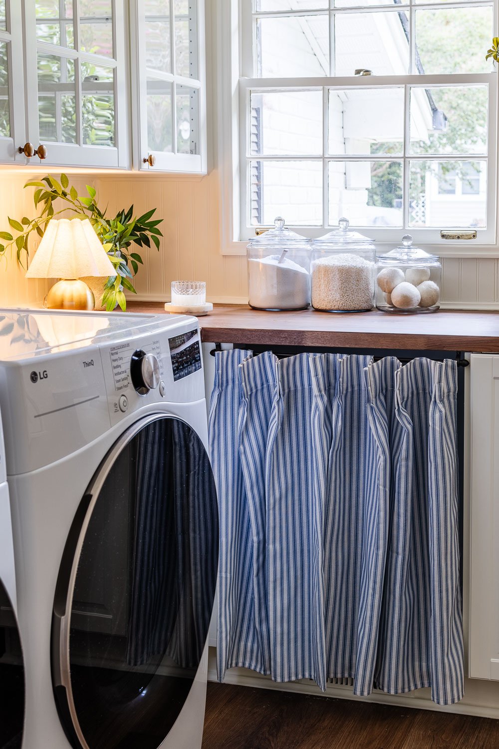 ticking stripe vintage cabinet skirt in laundry room