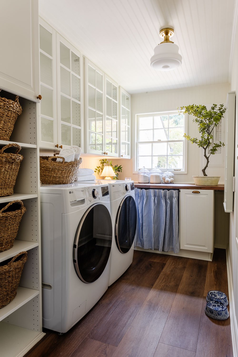 narrow laundry room layout with IKEA cabinets with vintage Nancy Meyers style
