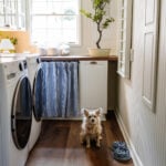 narrow laundry room layout with IKEA cabinets with vintage Nancy Meyers style