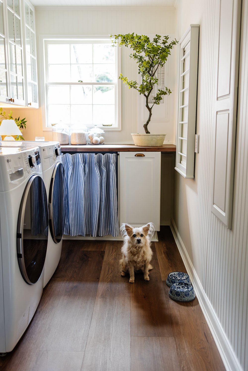 narrow laundry room layout with IKEA cabinets with vintage Nancy Meyers style