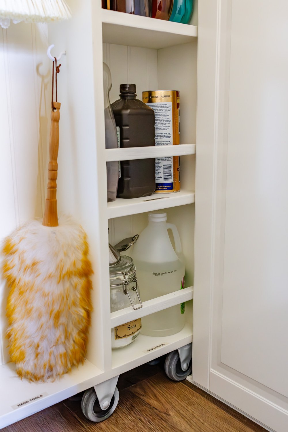 hidden diy broom cupboard and cleaning supply storage in a laundry room