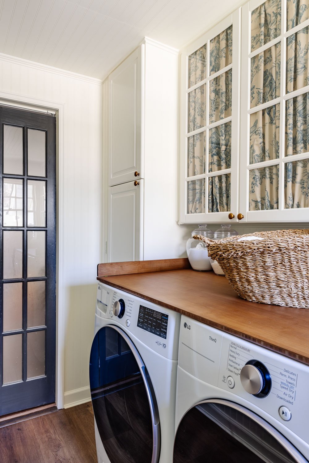 hidden diy broom cupboard and cleaning supply storage in a laundry room