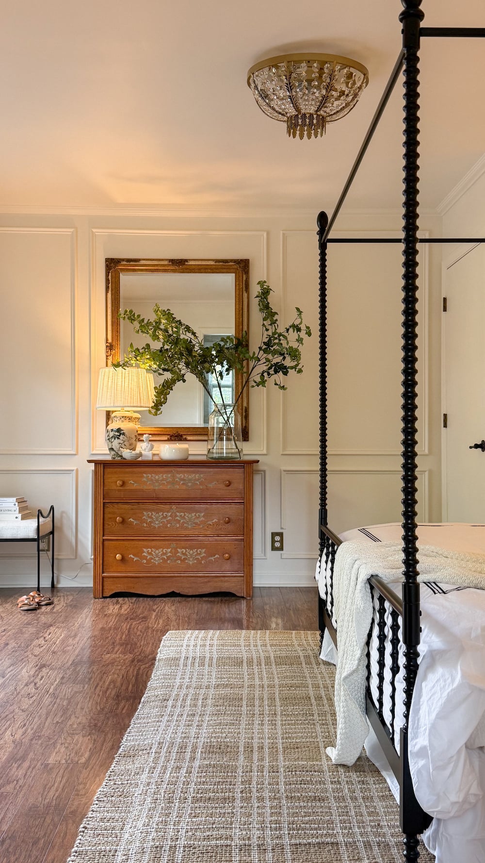 classic modern french country bedroom with layered lighting and canopy bed