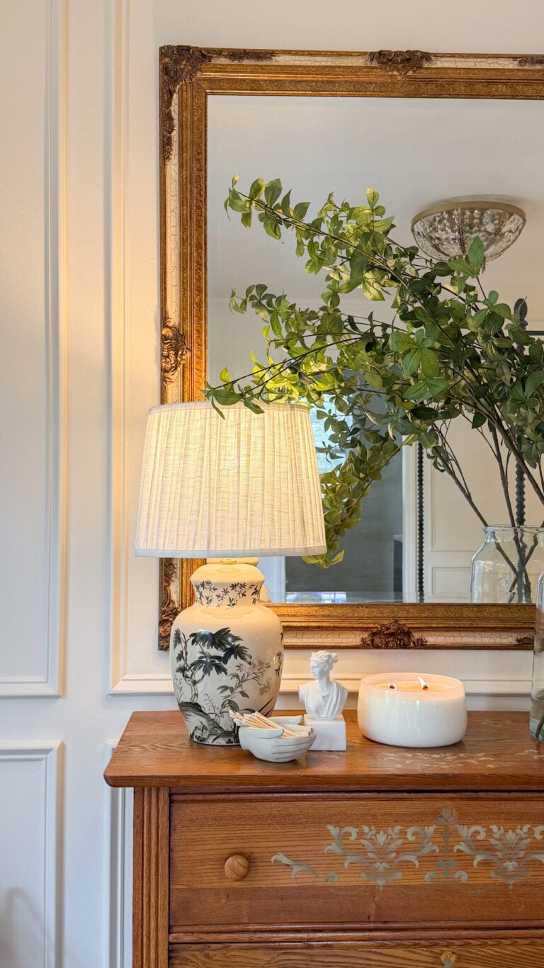 classic modern french country bedroom with layered lighting and canopy bed