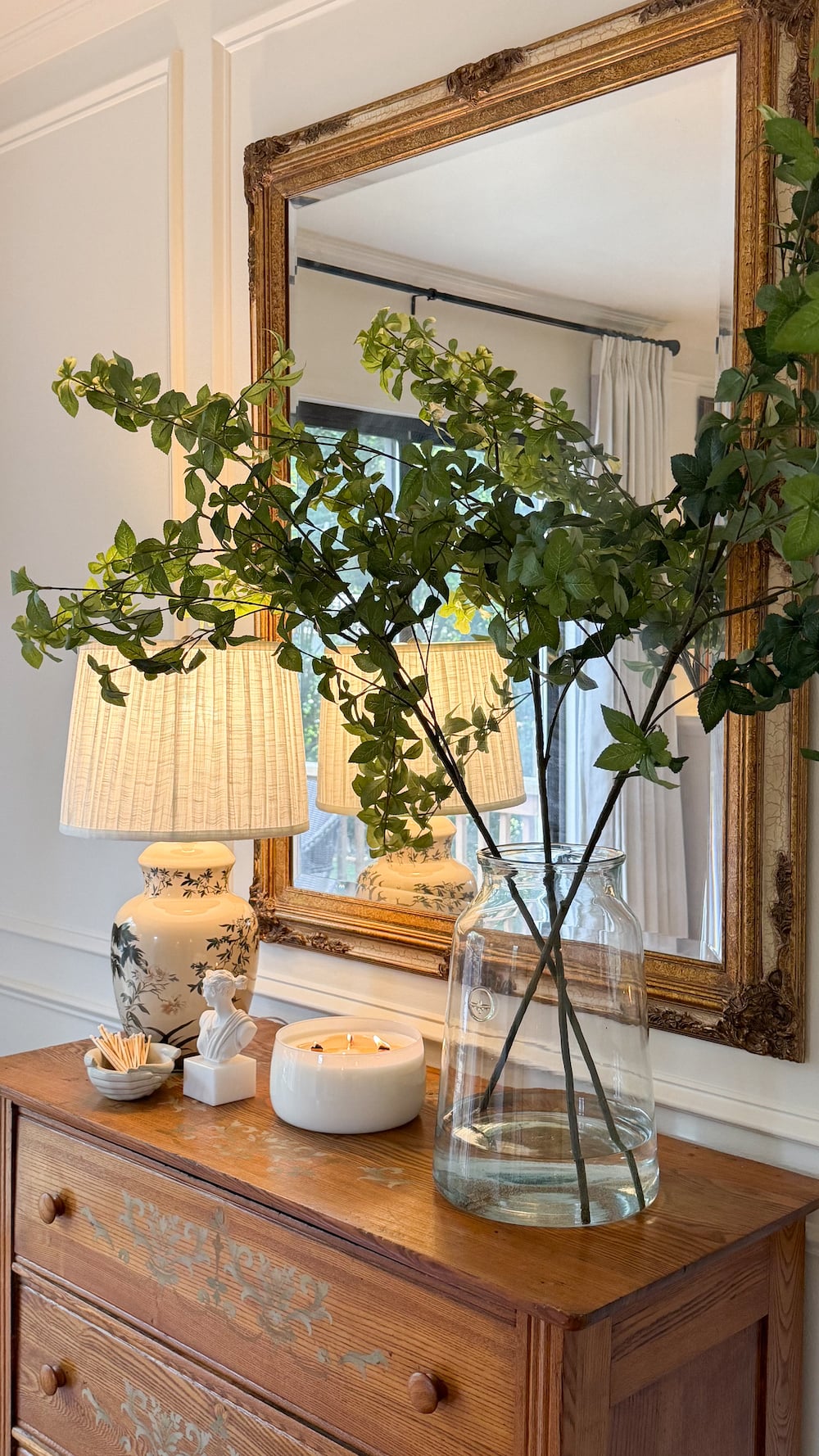 classic modern french country bedroom with layered lighting and canopy bed
