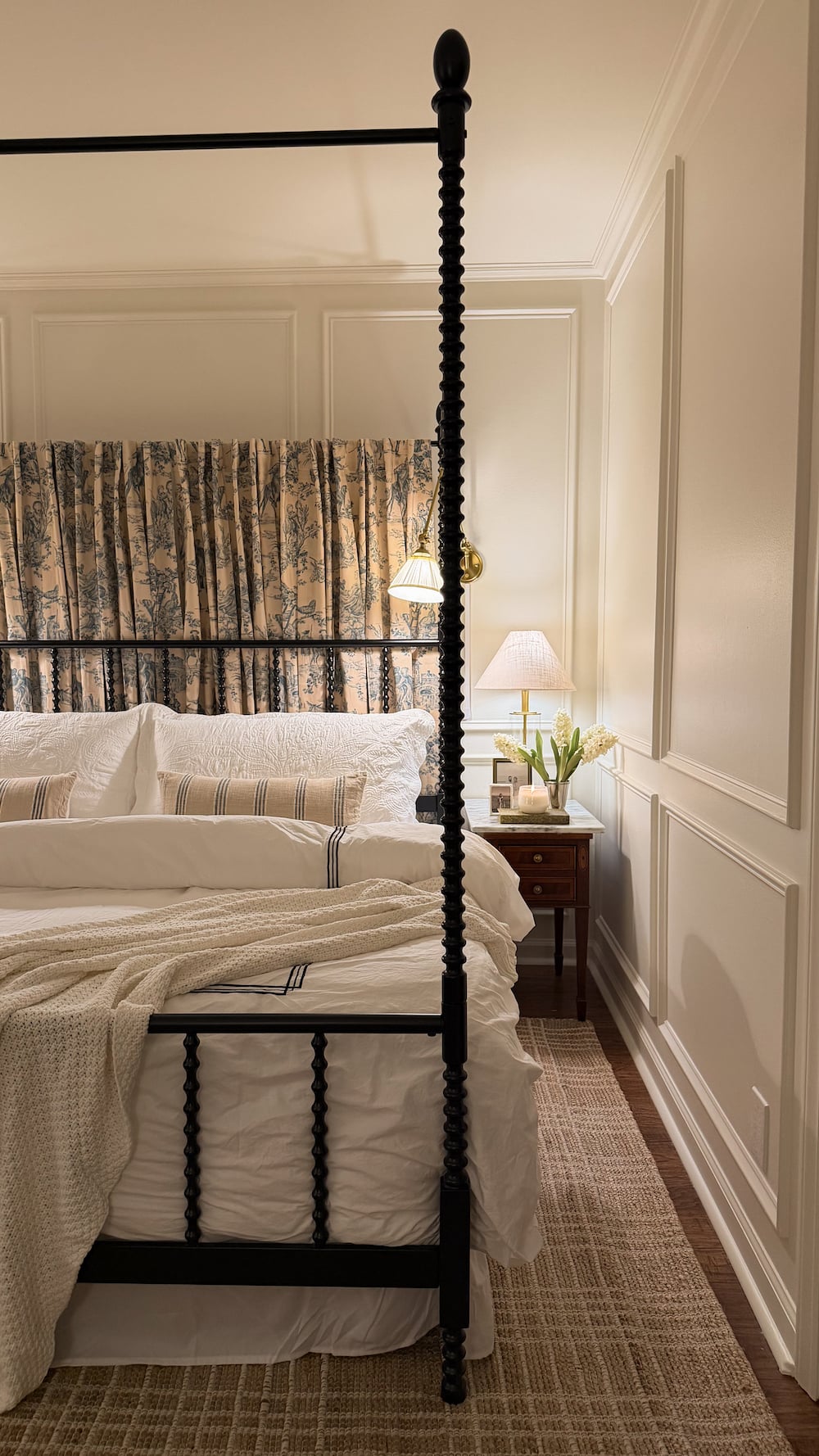 classic modern french country bedroom with layered lighting and canopy bed