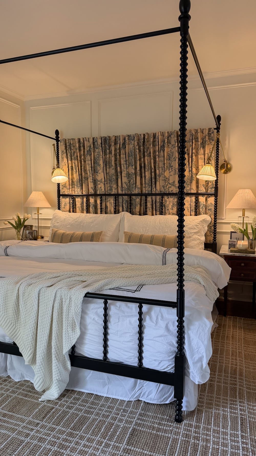 classic modern french country bedroom with layered lighting and canopy bed