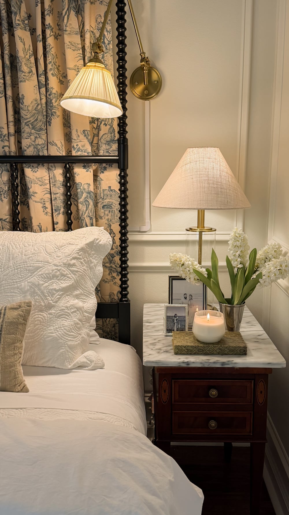 classic modern french country bedroom with layered lighting and canopy bed